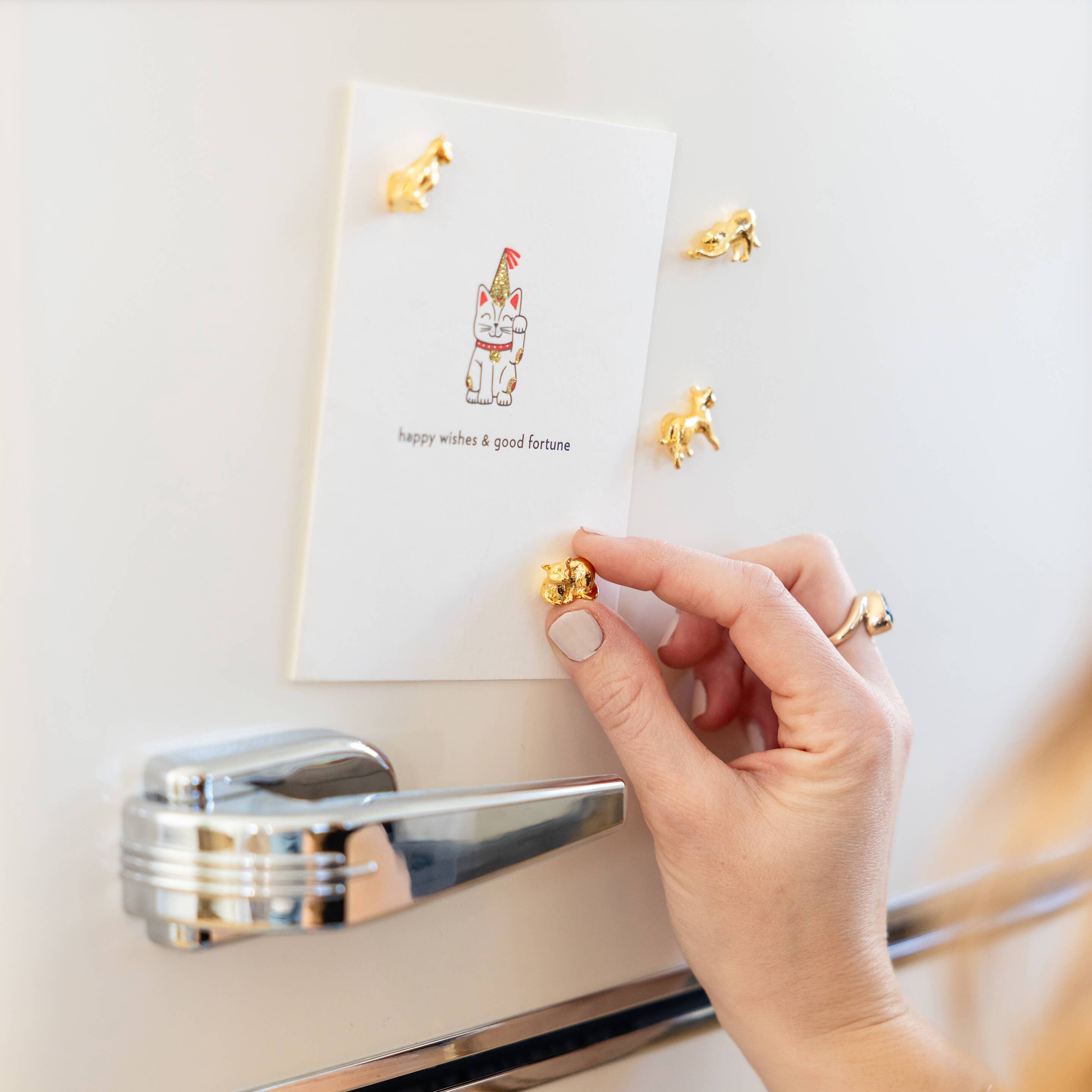 Cast metal cat magnets