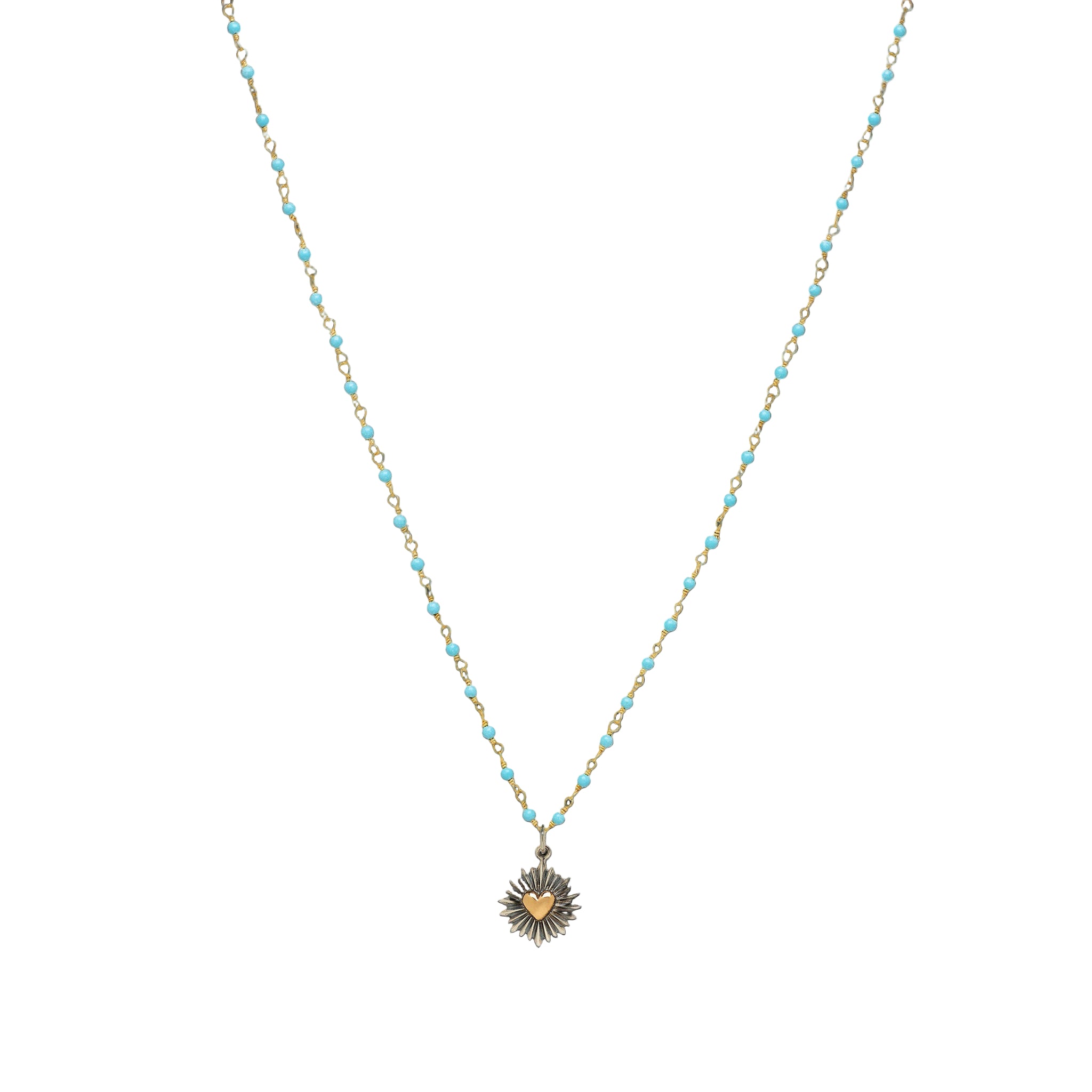 A turquoise necklace with a heart burst charm, displayed against a white background.